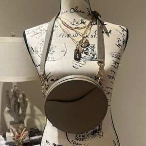 Cuyana taupe crossbody/waistbag with adjustable and removable strap.